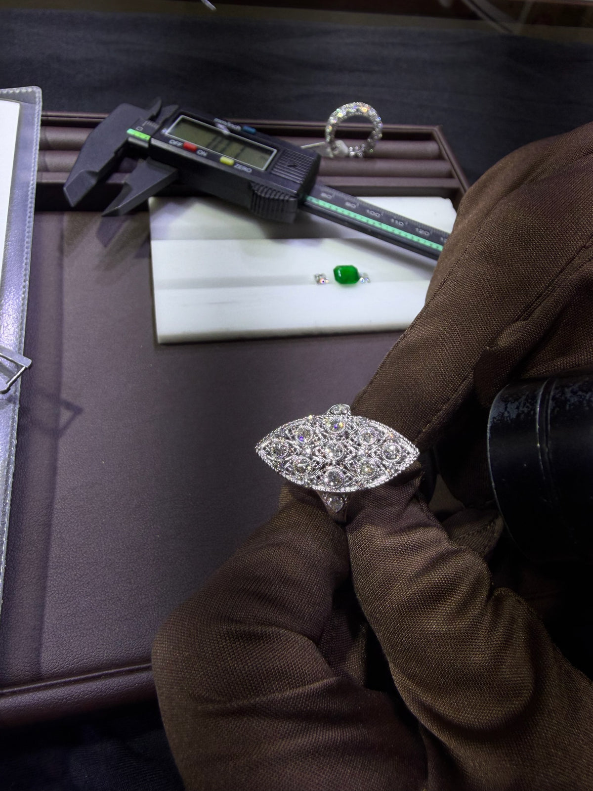 Konstantin Kupfer examining an antique diamond ring